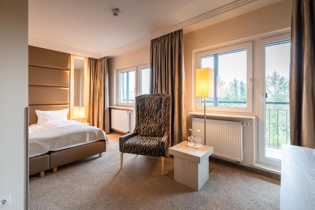 Postel nebo postele na pokoji v ubytování Thomas Hotel Spa & Lifestyle