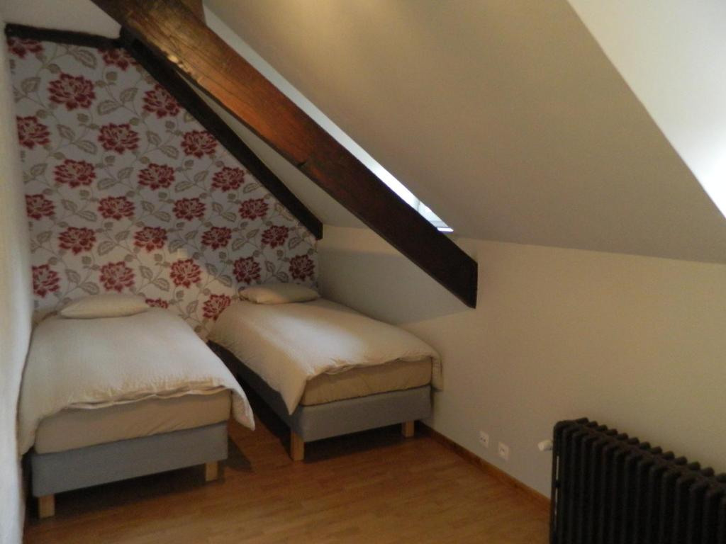 Postel nebo postele na pokoji v ubytování B&B Les Tchéous