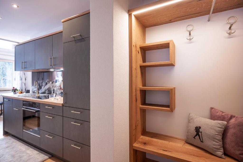 Kuchyň nebo kuchyňský kout v ubytování otto steiner appartements pension ellmau & wilder kaiser