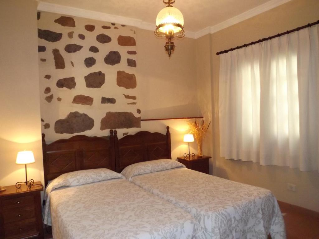 Posteľ alebo postele v izbe v ubytovaní Casa Rural Doña Margarita
