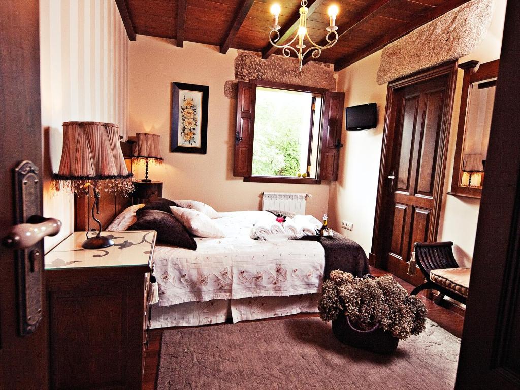 Postel nebo postele na pokoji v ubytování Casa da Muiñeira