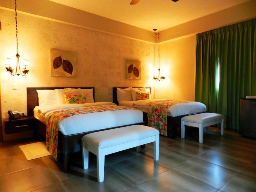 Postel nebo postele na pokoji v ubytování MON Hotel Boutique