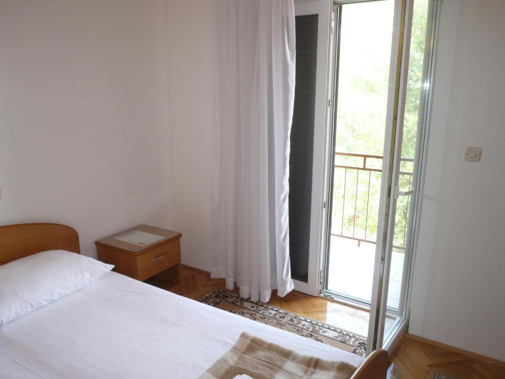 Postel nebo postele na pokoji v ubytování Apartments Šarić