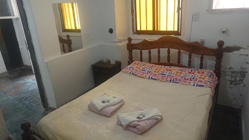 A bed or beds in a room at Apartamentos Quintana