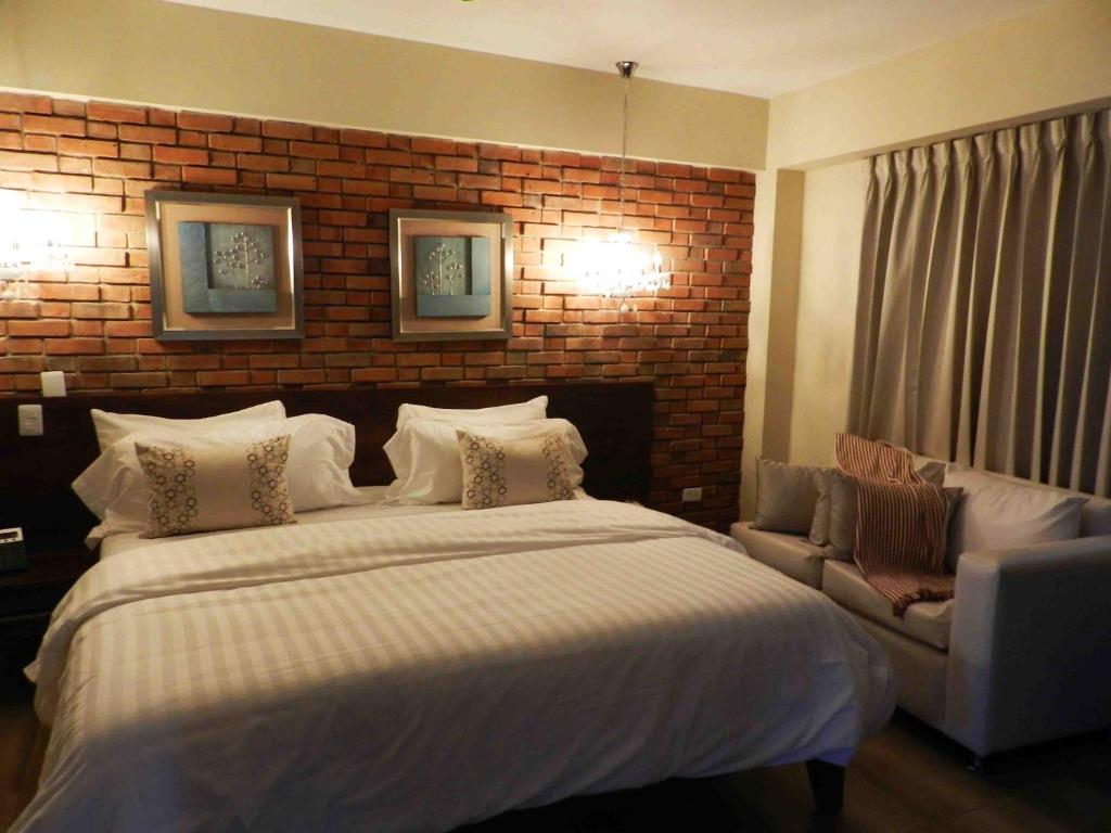 Postel nebo postele na pokoji v ubytování MON Hotel Boutique