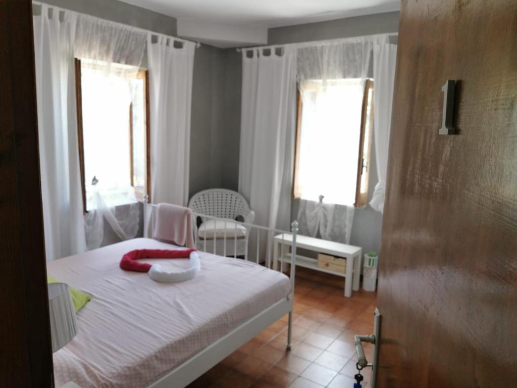Łóżko lub łóżka w pokoju w obiekcie Al Passo di Thalia