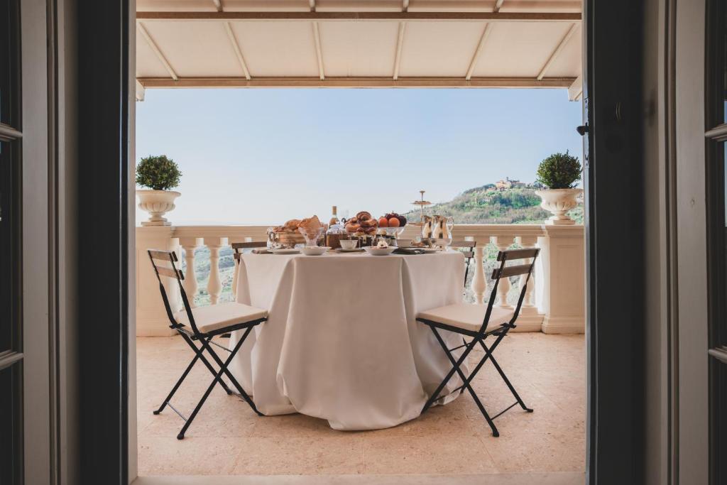 a dining room with a table and chairs with a view at Alfresco luxury Villa with Heated pool in Montecatini Terme