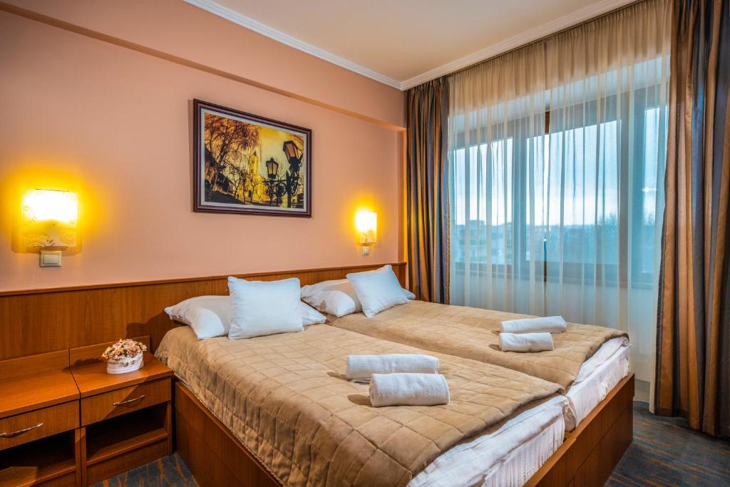 Posteľ alebo postele v izbe v ubytovaní Duna Hotel