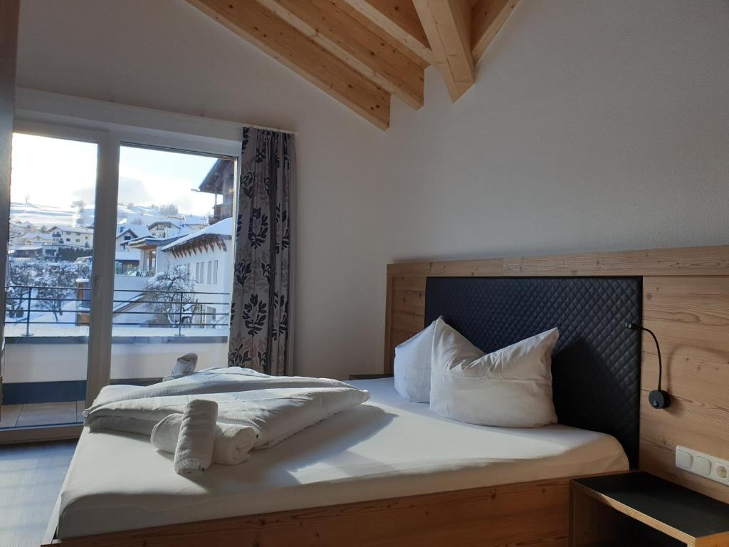 Postel nebo postele na pokoji v ubytování Apart Alpengenuss