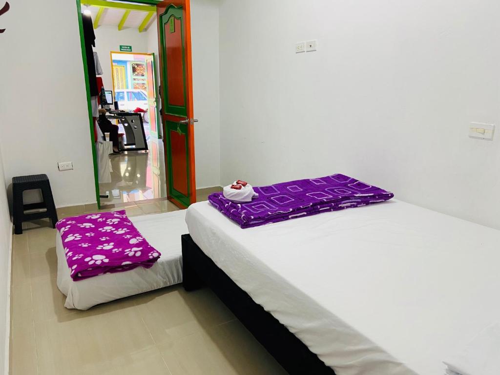 Postel nebo postele na pokoji v ubytování casa hostal las palmeras