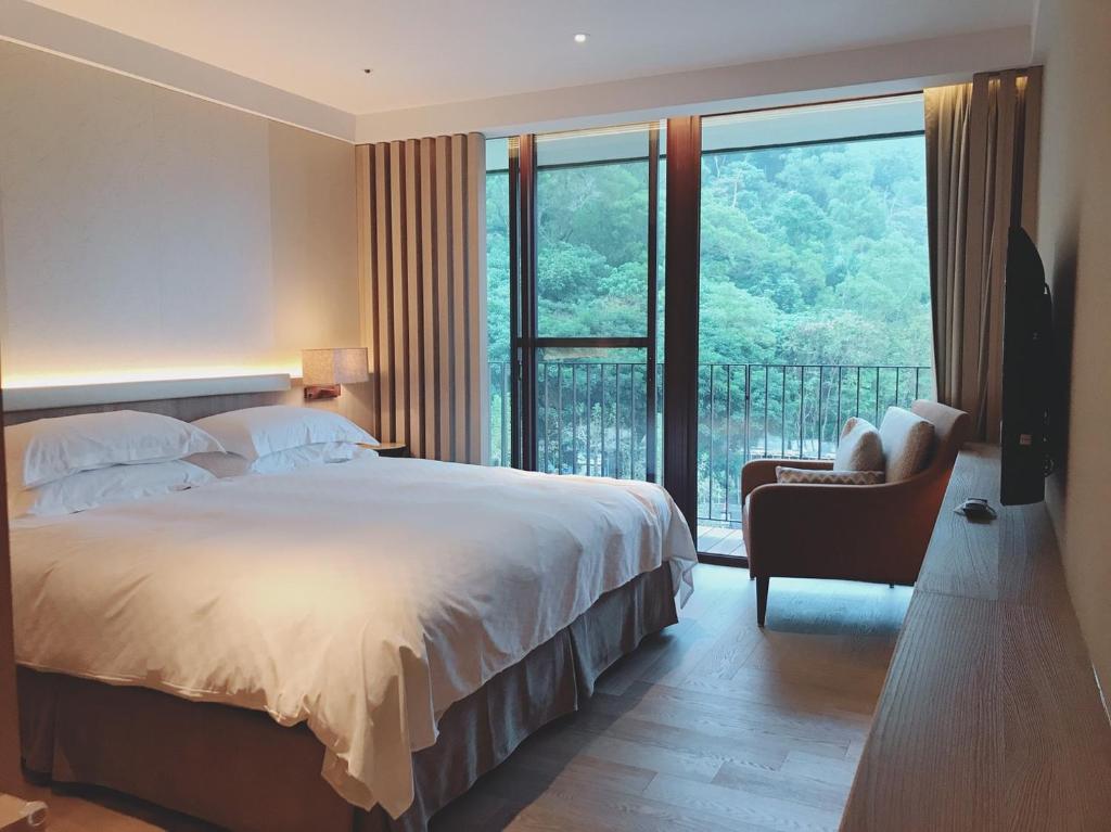 Postel nebo postele na pokoji v ubytování Hotel Royal Chiao Hsi