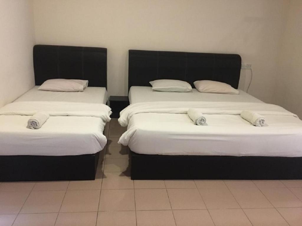 Postel nebo postele na pokoji v ubytování Anderson Hotel