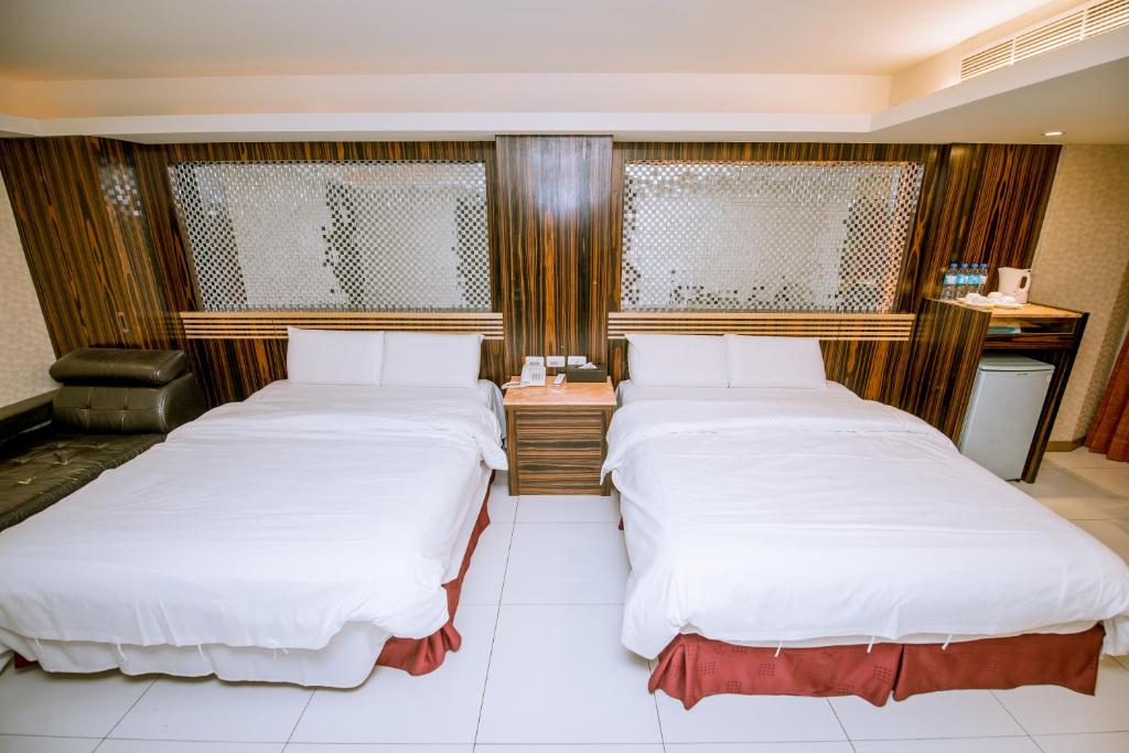 Postel nebo postele na pokoji v ubytování Guide Hotel Taipei Xinyi