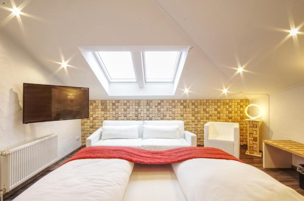 Postel nebo postele na pokoji v ubytování Hotel Jakob