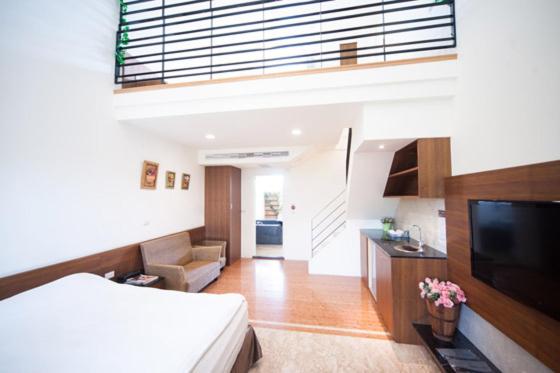 TV a/nebo společenská místnost v ubytování Palm Island B&B