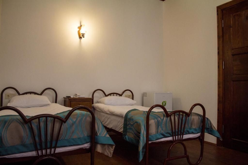 Postel nebo postele na pokoji v ubytování Lal Hotel Bursa
