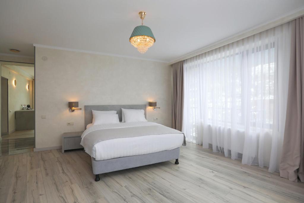 Postel nebo postele na pokoji v ubytování Sunset Terrace Mestia