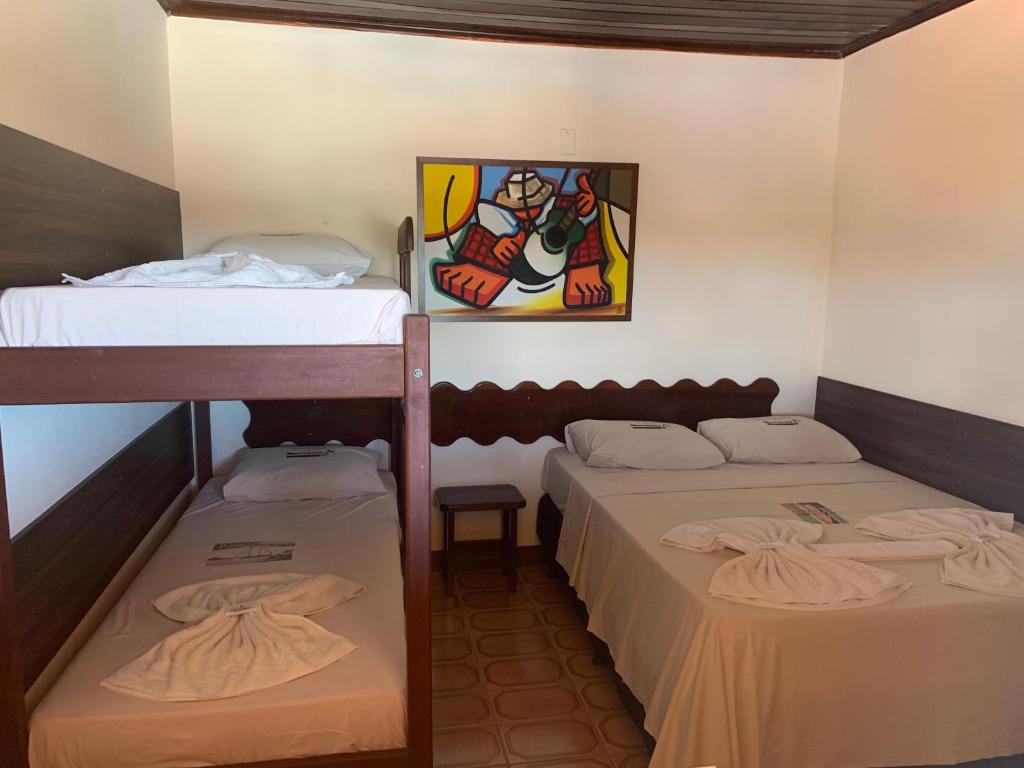 Postel nebo postele na pokoji v ubytování Pousada Paradise
