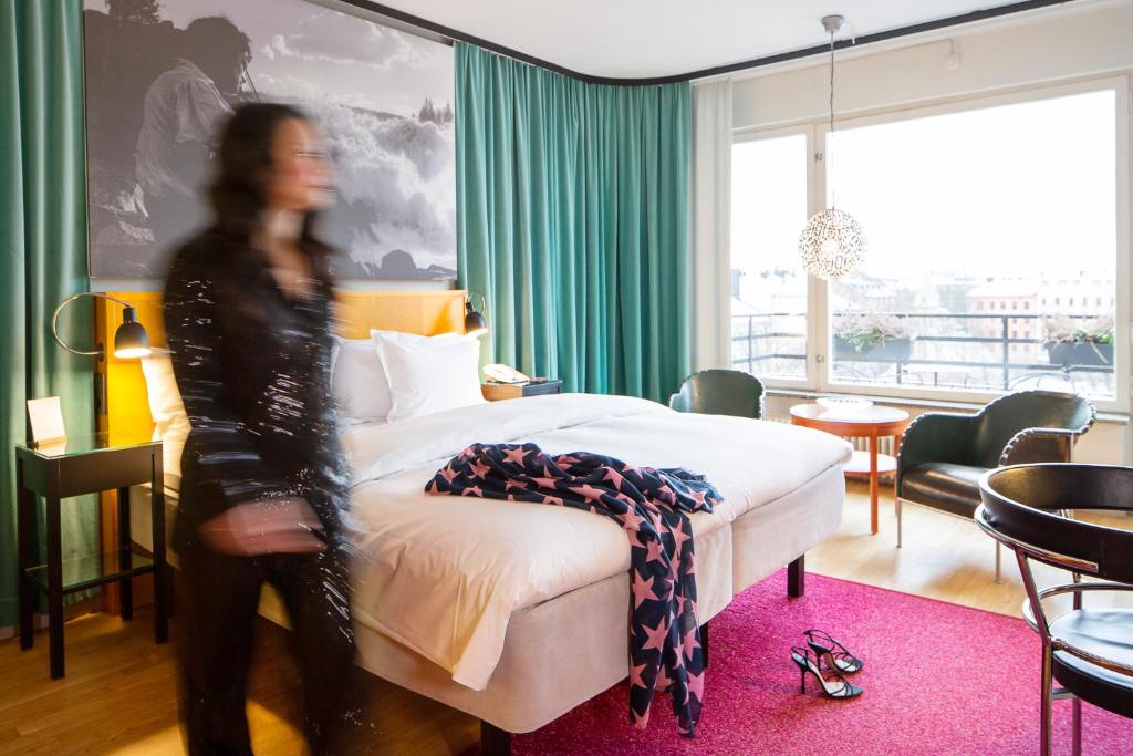 Postel nebo postele na pokoji v ubytování Hotel Rival