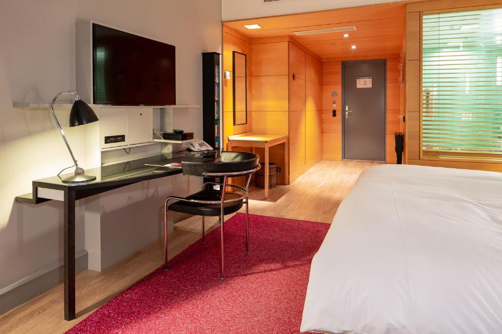 Postel nebo postele na pokoji v ubytování Hotel Rival