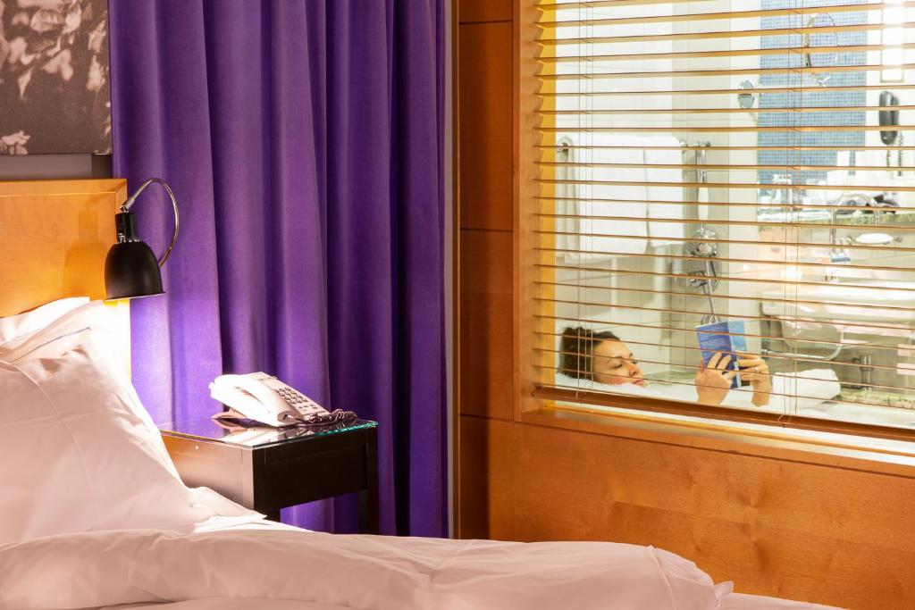 Postel nebo postele na pokoji v ubytování Hotel Rival