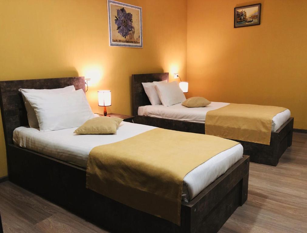 Postel nebo postele na pokoji v ubytování Hotel Nabadi