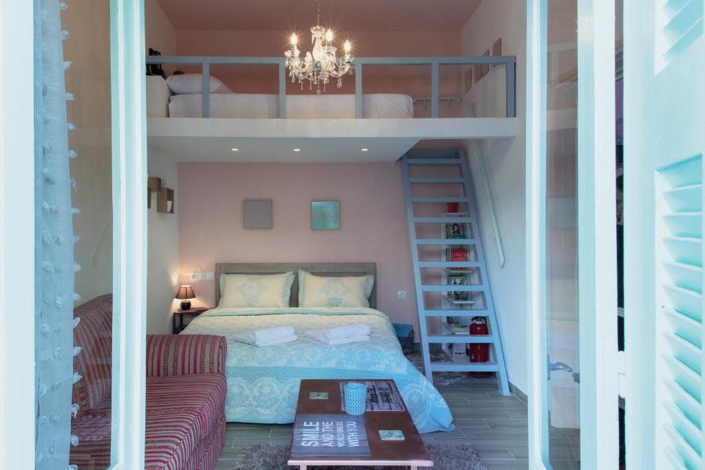 a bedroom with a bunk bed and a staircase at Rodia in Volos