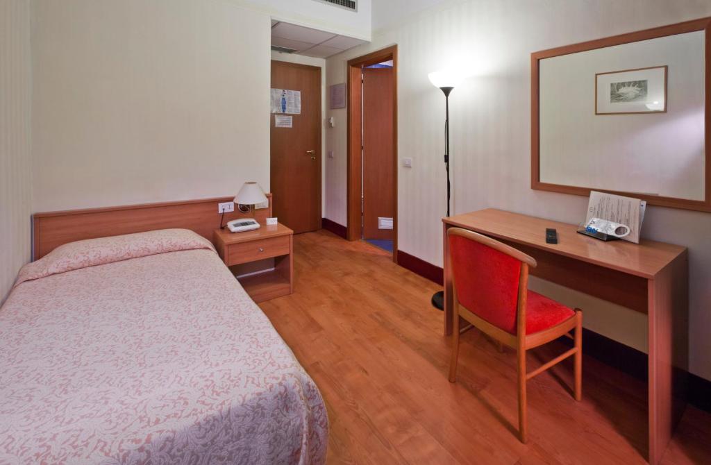 Postel nebo postele na pokoji v ubytování Hotel Fortuna