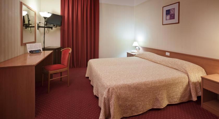 Postel nebo postele na pokoji v ubytování Hotel Fortuna