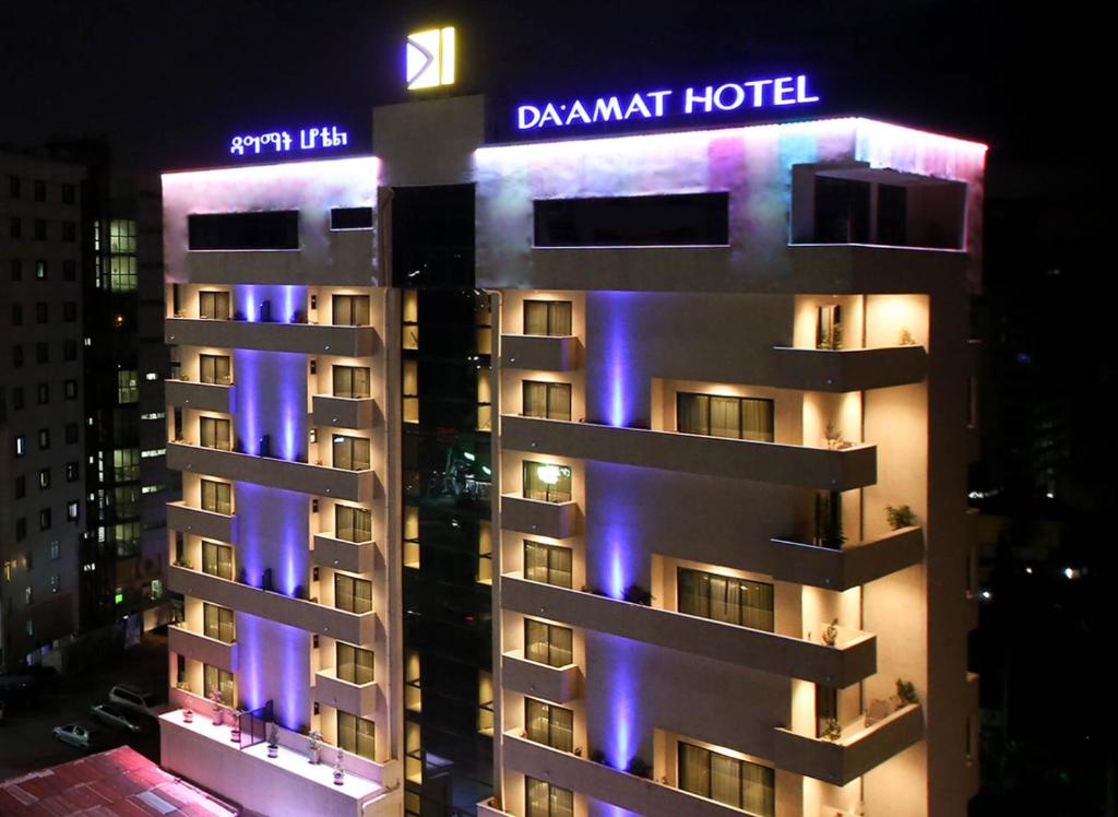 a building with purple lights on the side of it at Daamat Hotel in Addis Ababa