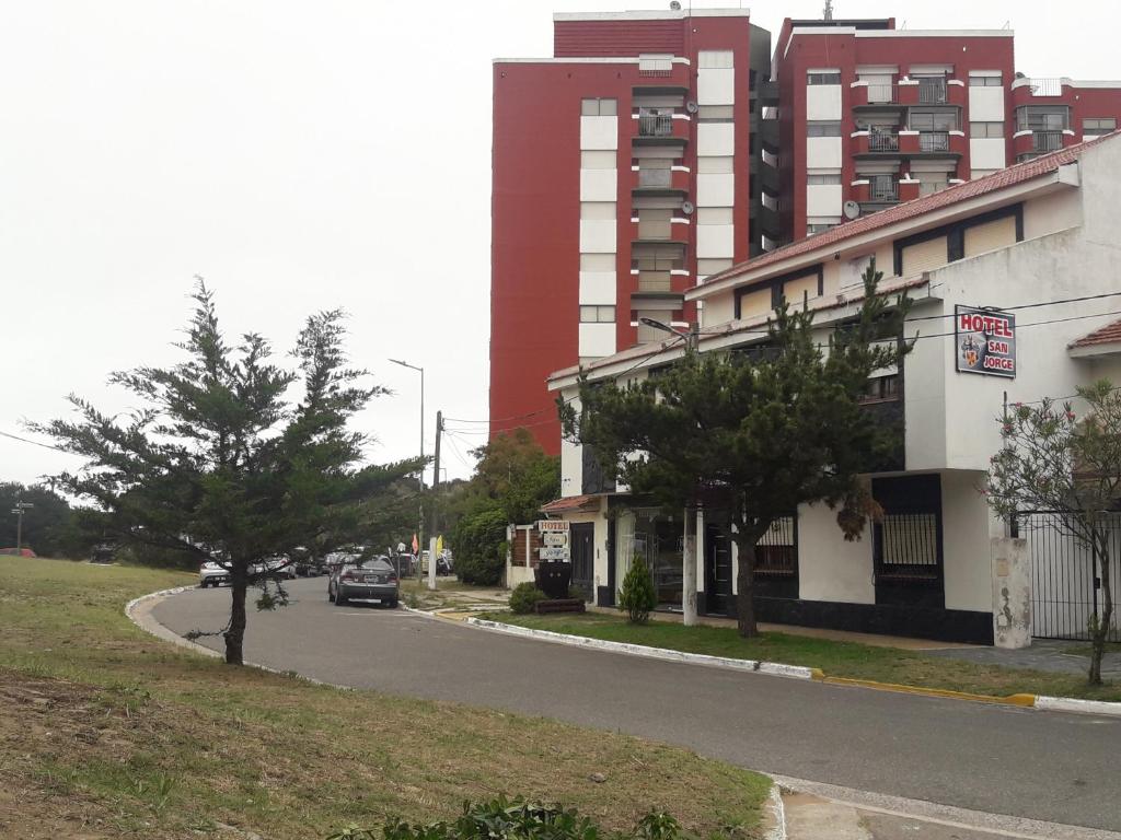 a car is parked on a street next to a building at HOTEL SAN JORGE in San Clemente