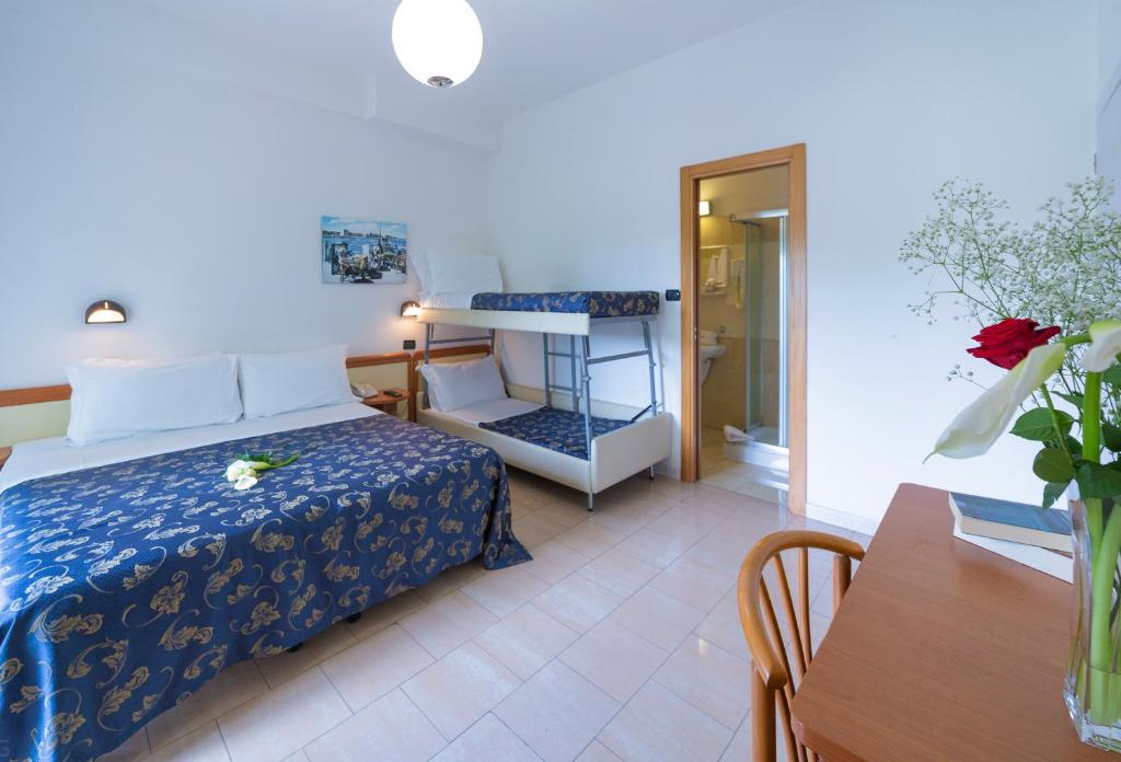 Postel nebo postele na pokoji v ubytování Hotel Sultano