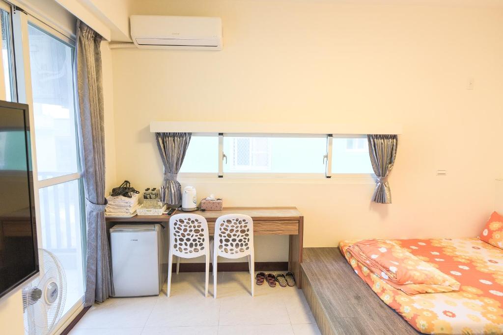 Postel nebo postele na pokoji v ubytování Sing Fu Hua Homestay
