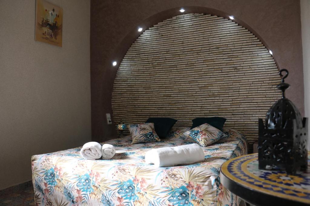a bed with towels on it in a room at Riad Les Chtis D'Agadir in Agadir