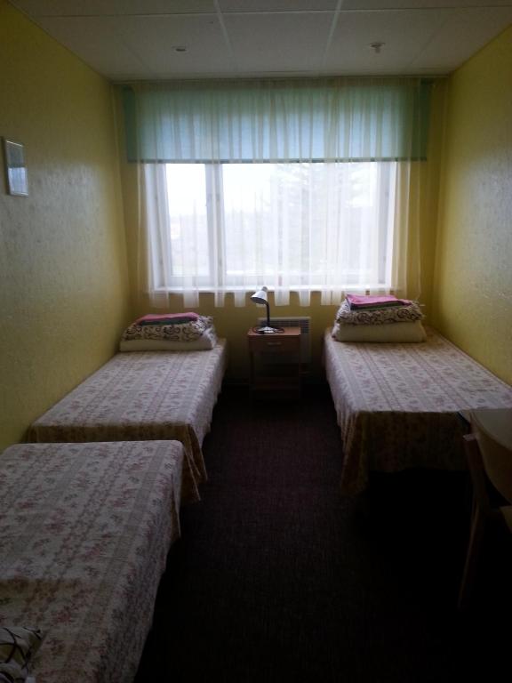Postel nebo postele na pokoji v ubytování Vinni Hostel