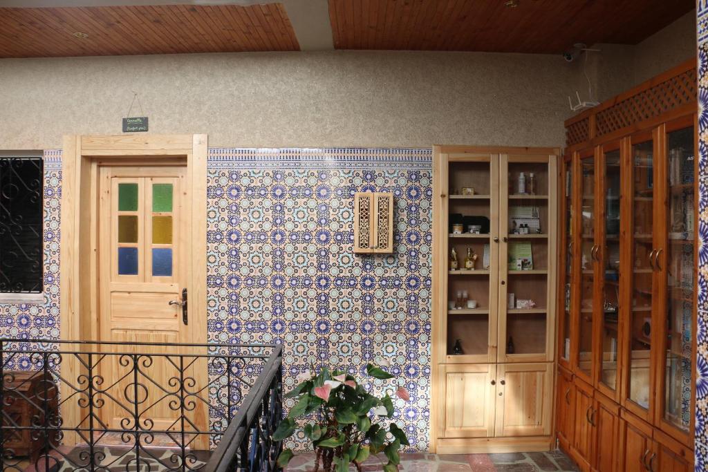 a room with a blue and white tiled wall at Riad Les Chtis D'Agadir in Agadir