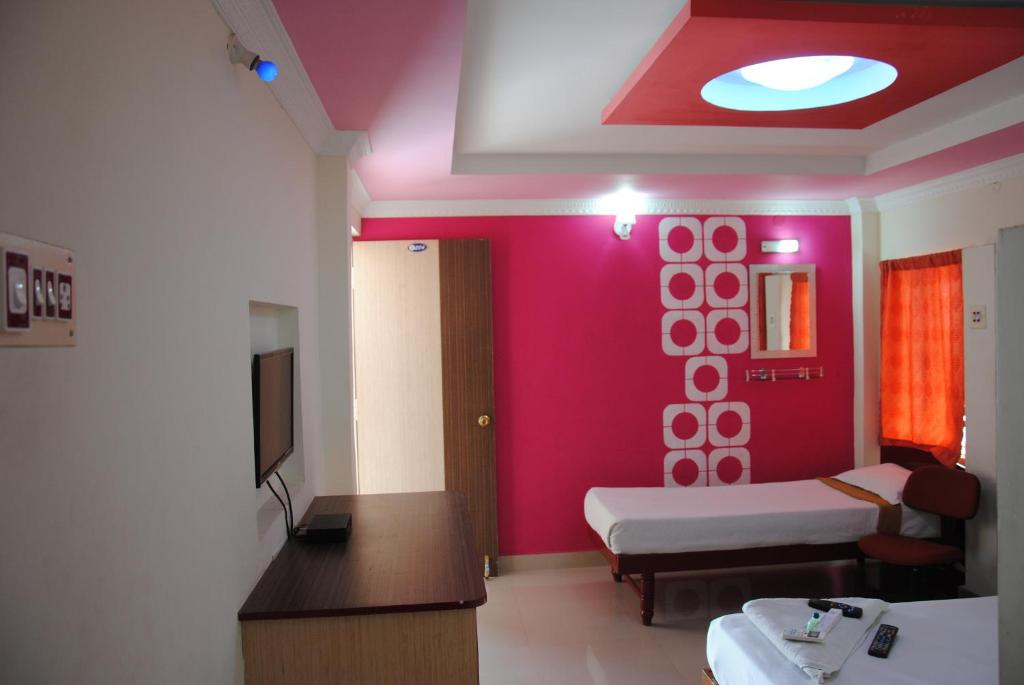 Postel nebo postele na pokoji v ubytování Just Guest House, Chennai Airport