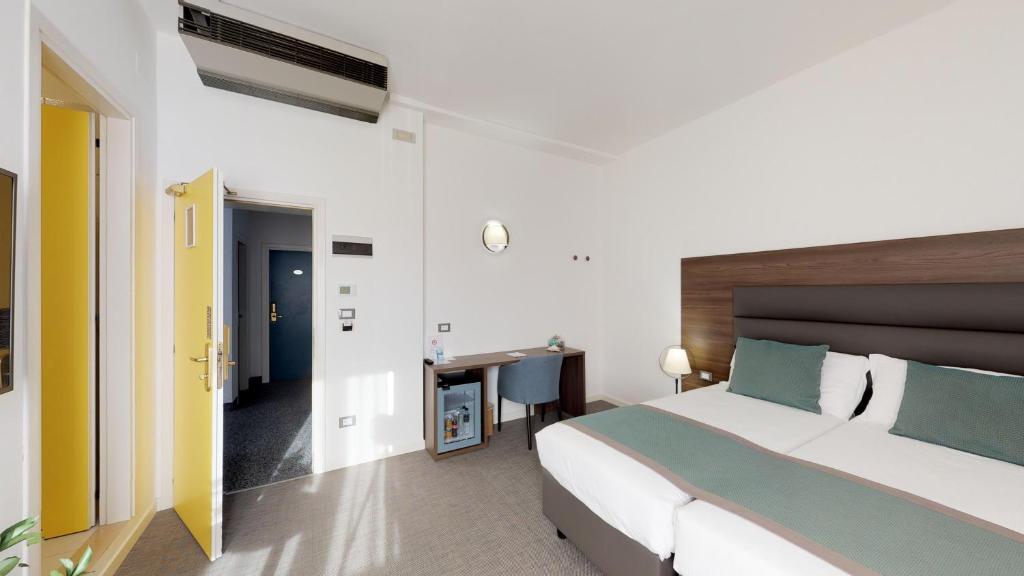 Postel nebo postele na pokoji v ubytování Hotel Villa Sorriso