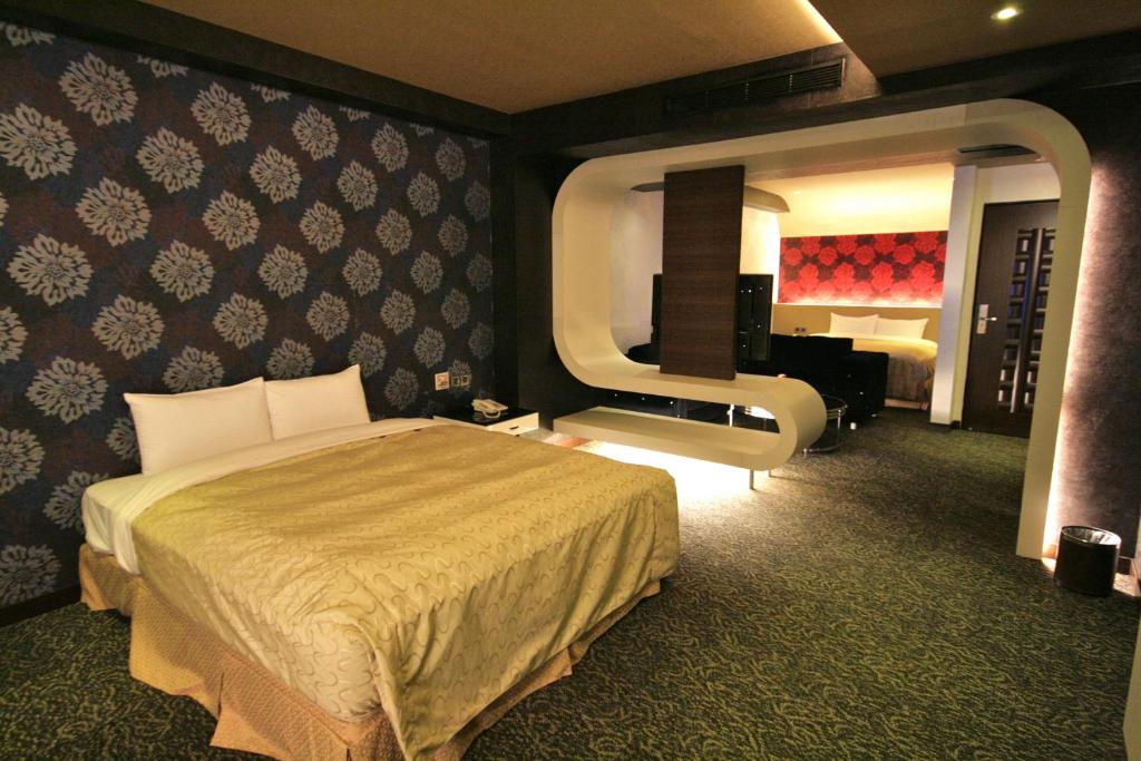 Postel nebo postele na pokoji v ubytování Fairy Tale City Motel