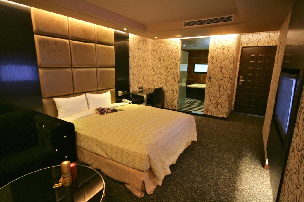 Postel nebo postele na pokoji v ubytování Fairy Tale City Motel