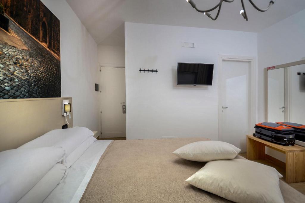 Postel nebo postele na pokoji v ubytování B&B Sorrento Queen