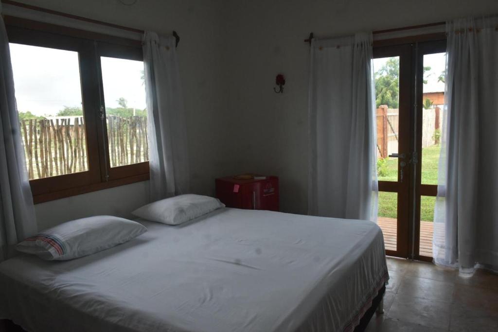 Postel nebo postele na pokoji v ubytování TROPICAL HOUSE ATINS