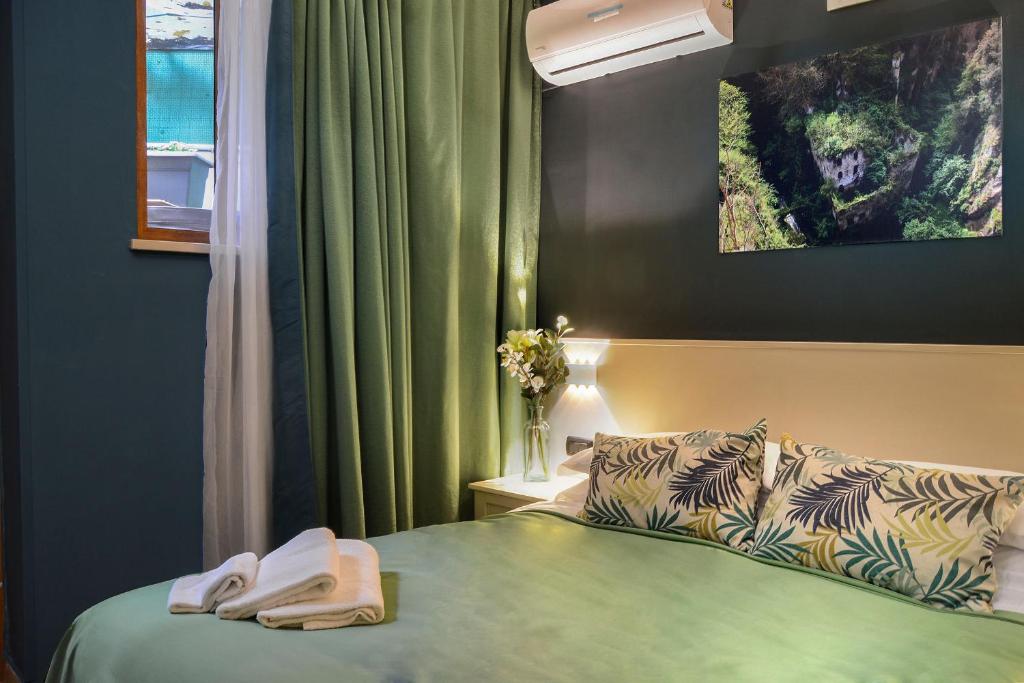 Postel nebo postele na pokoji v ubytování B&B Sorrento Queen