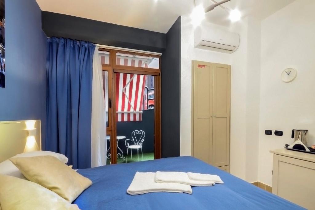 Postel nebo postele na pokoji v ubytování B&B Sorrento Queen