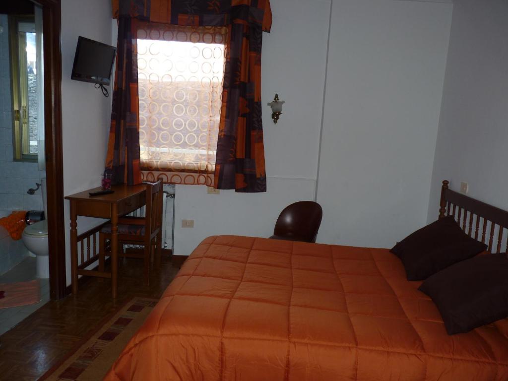 Postel nebo postele na pokoji v ubytování Hotel España