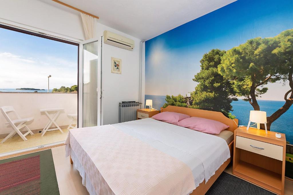 Postel nebo postele na pokoji v ubytování Apartments Pilicari