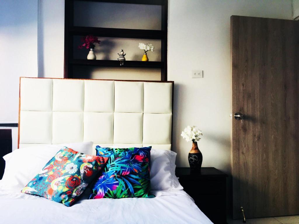 Postel nebo postele na pokoji v ubytování SAN JACINTO HOSTEL