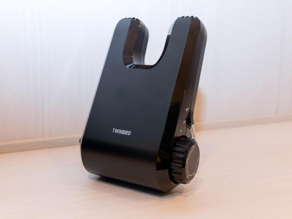 a toaster sitting on top of a wooden floor at LIBER HOTEL Osaka in Osaka