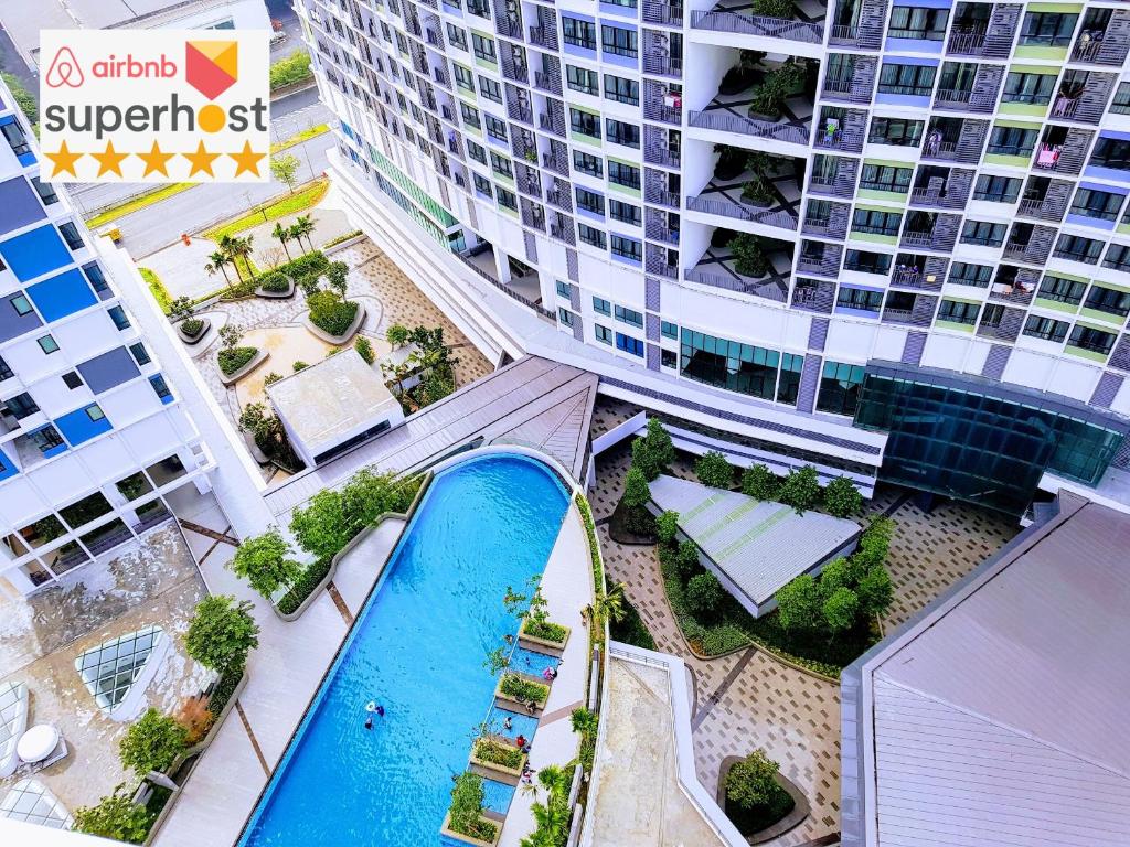 an overhead view of a building with a swimming pool at Casa Sabrina's Family Suite @ Liberty i-City, Shah Alam in Shah Alam