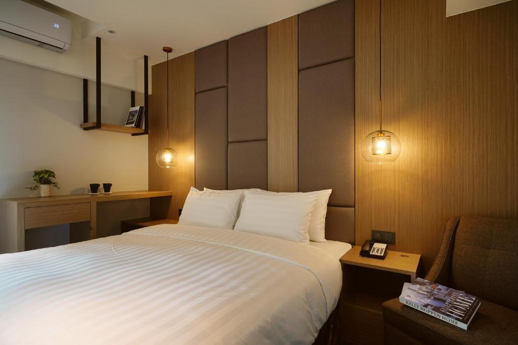 Postel nebo postele na pokoji v ubytování E Hotel